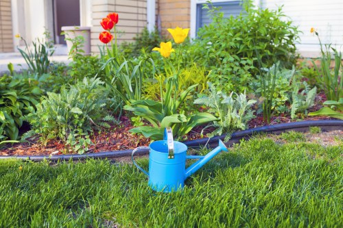 Soil preparation and edging for flower bed creation in Barbican