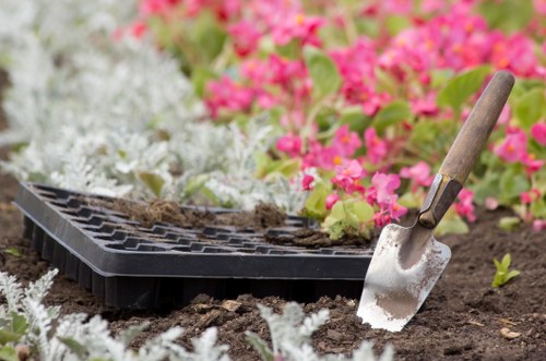 Professional landscaper in Barbican reviewing site safety before work