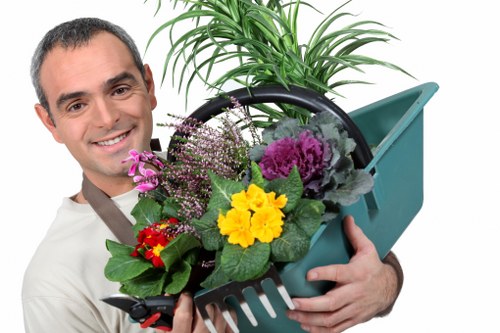 Professional garden maintenance tasks in a Barbican courtyard